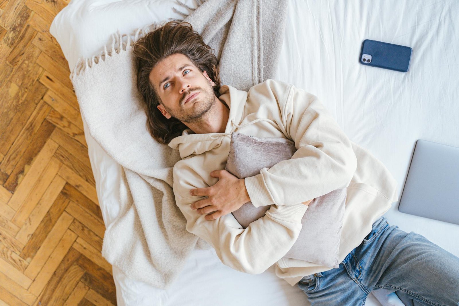 a man lying on the bed